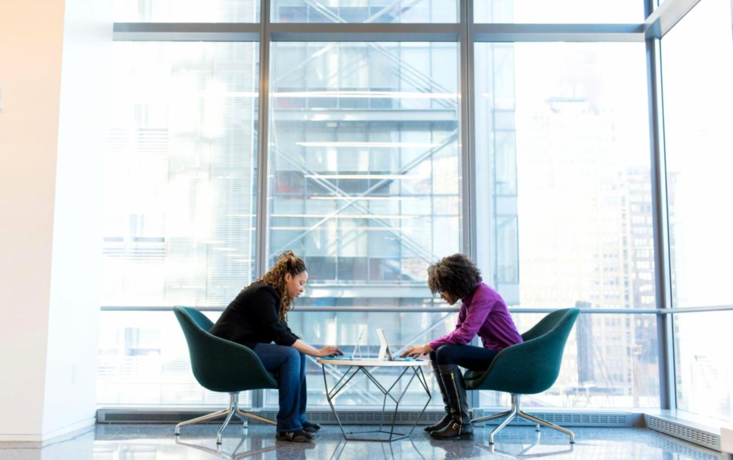 Financial planning workspace with documents and laptop